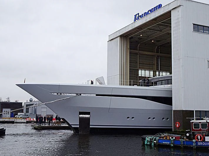 a large white boat in a body of water aboard ARROW Yacht for Sale