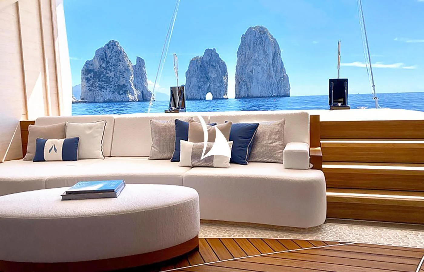 a couch with pillows on it aboard ARROW Yacht for Sale