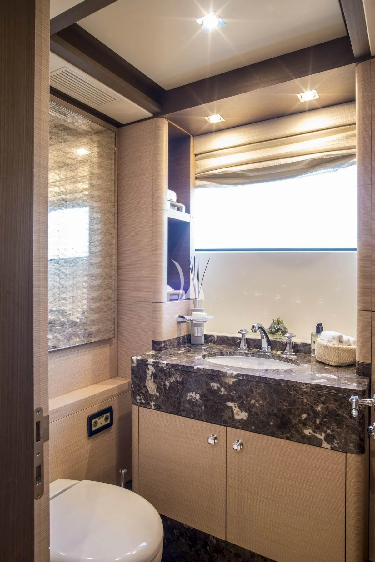 a bathroom with a sink and a toilet aboard NELA Yacht for Charter