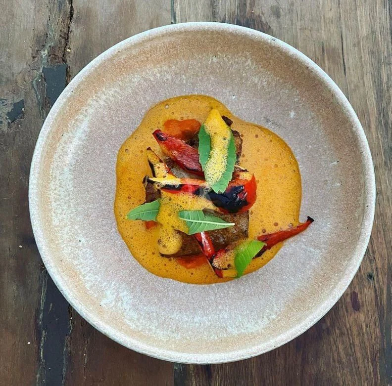 a bowl of soup aboard NELA Yacht for Charter