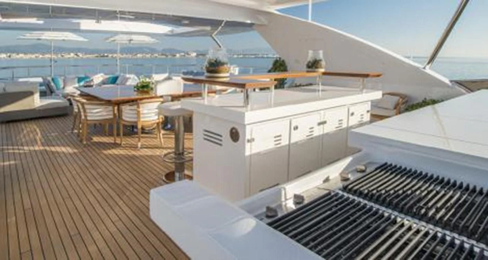 a deck with a deck and a pool aboard NELA Yacht for Charter