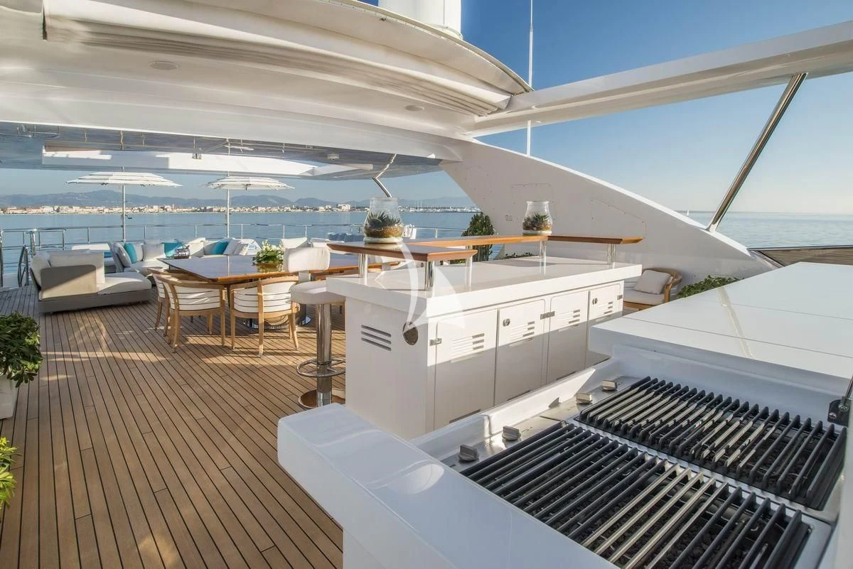 a room with a deck and a pool aboard NELA Yacht for Charter