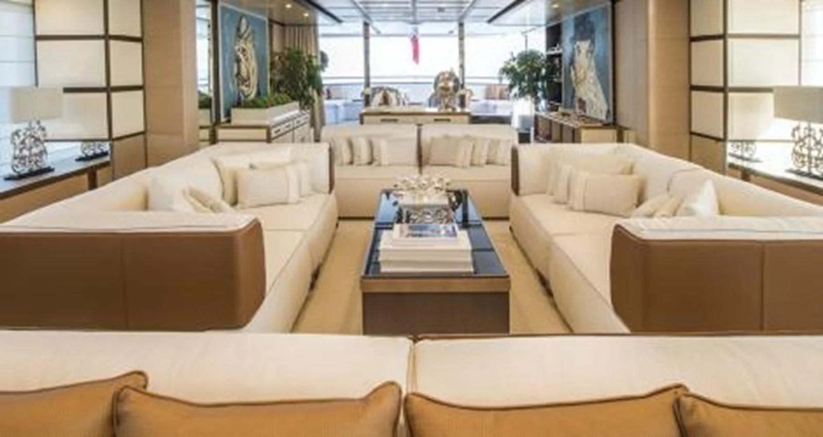 a living room with white couches aboard NELA Yacht for Charter
