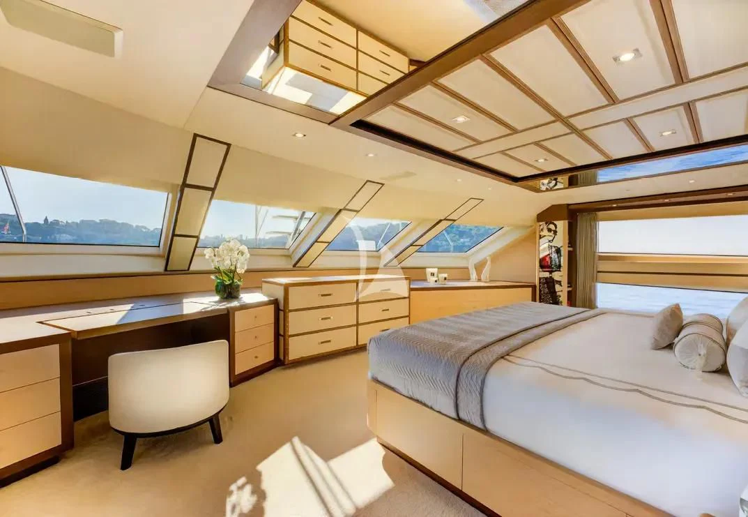 a bedroom with a desk and a bed aboard NELA Yacht for Charter