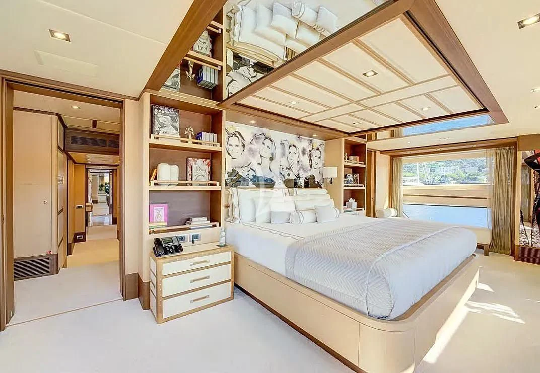 a bedroom with a large bed aboard NELA Yacht for Charter