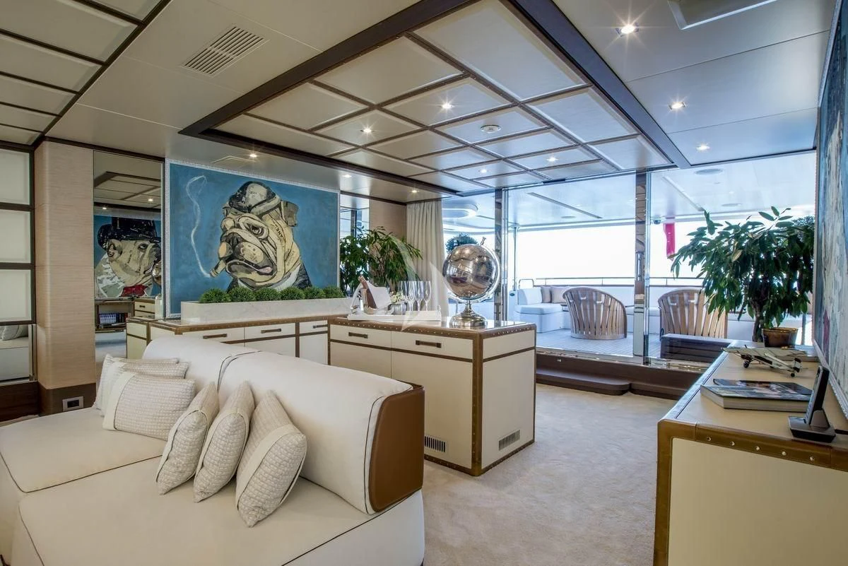 a living room with a large window aboard NELA Yacht for Charter