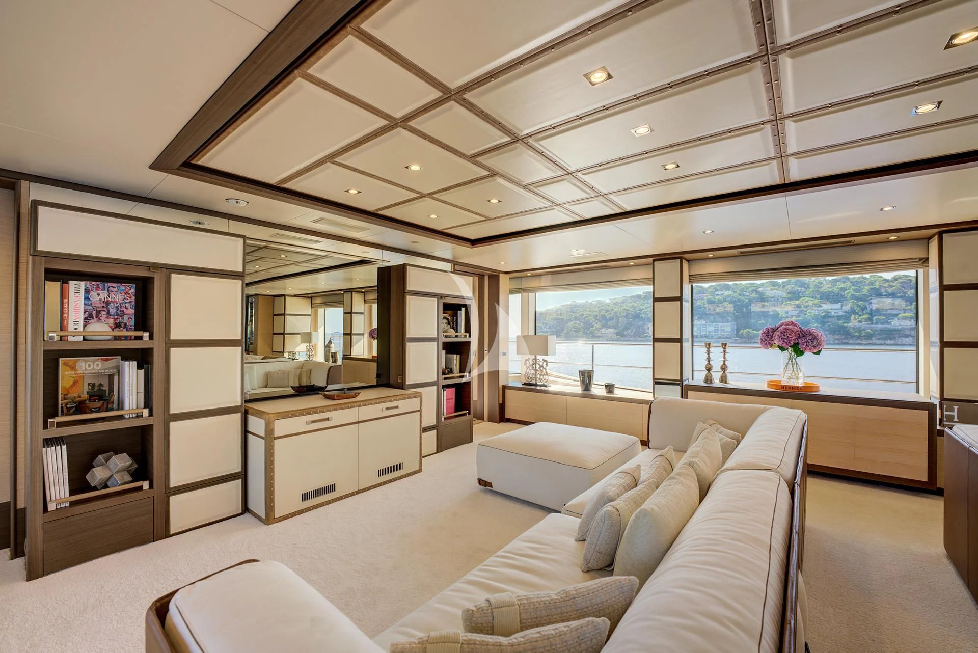 a living room with a large window aboard NELA Yacht for Charter