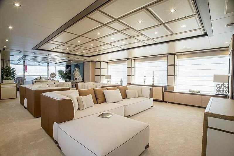 a large room with a couch and a table aboard NELA Yacht for Charter