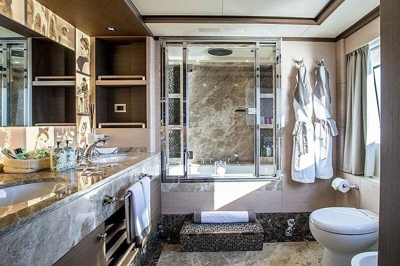 a bathroom with a large window aboard NELA Yacht for Charter