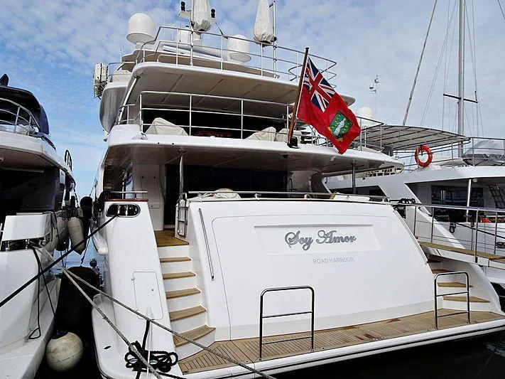 a large boat with a flag on it aboard NELA Yacht for Charter