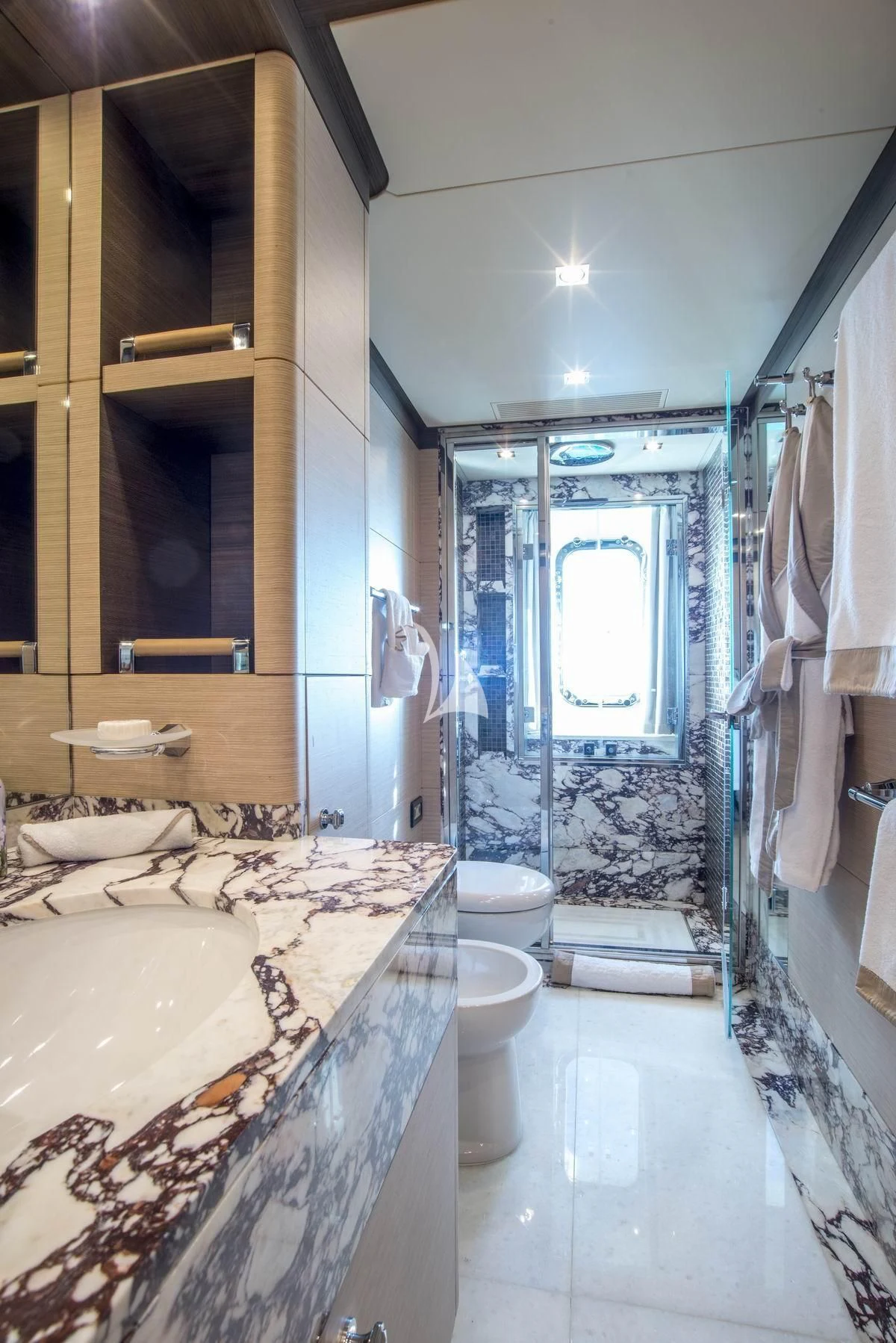 a bathroom with a marble counter top aboard NELA Yacht for Charter