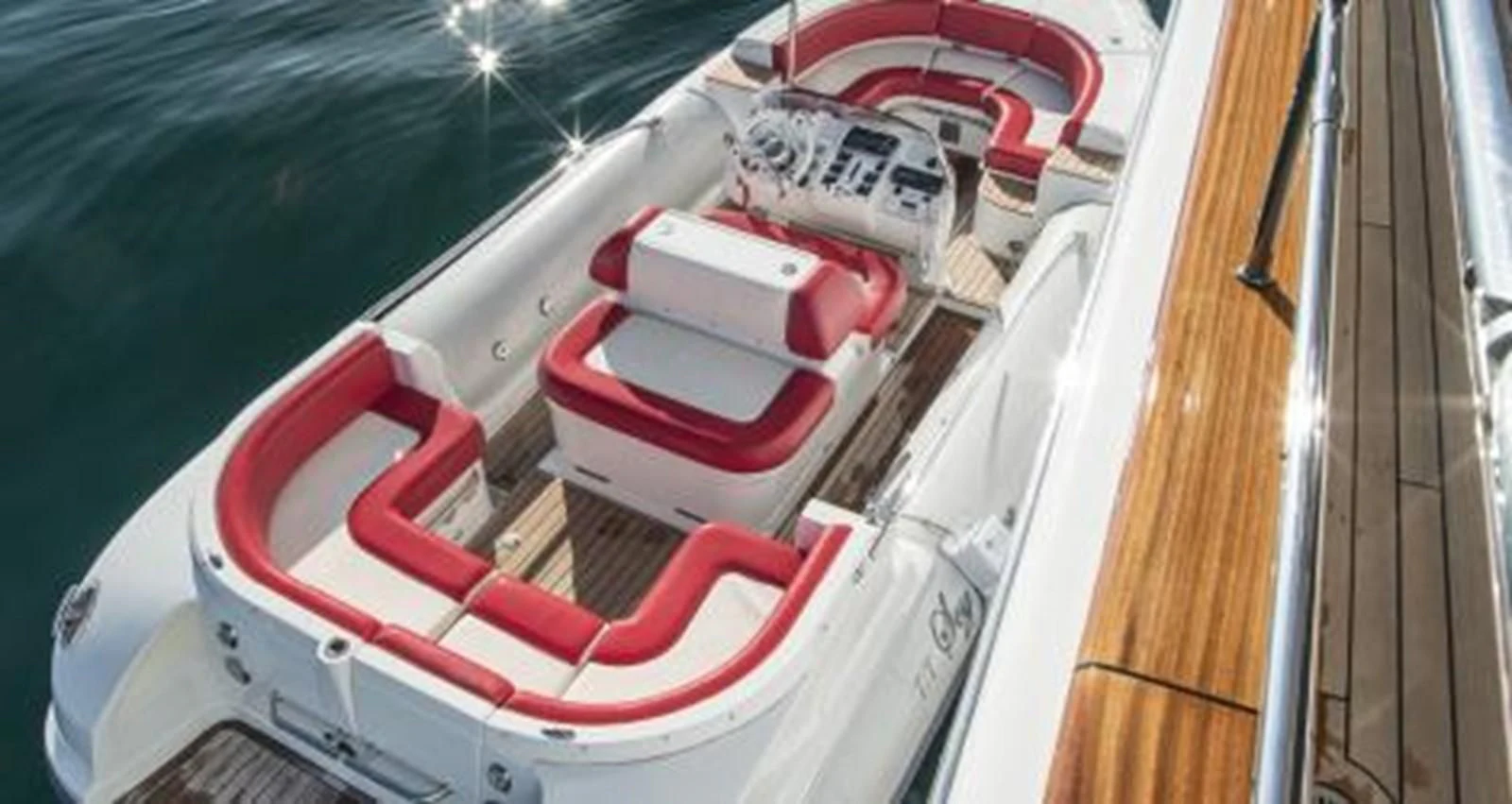 a red and white car aboard NELA Yacht for Charter