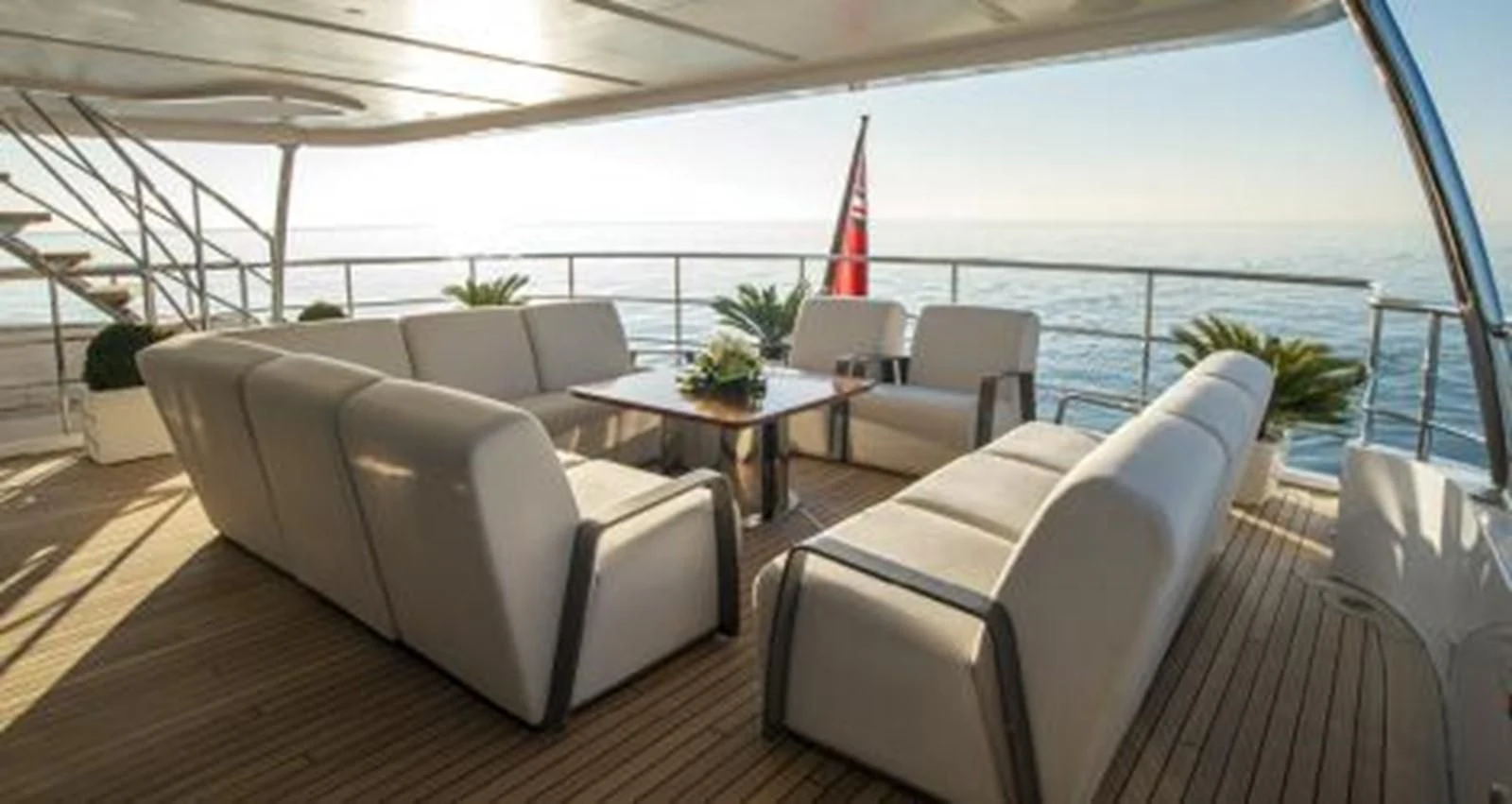 a living room with a view of the ocean aboard NELA Yacht for Charter