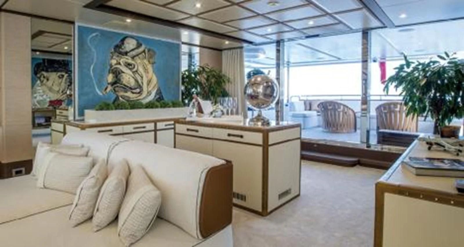 a living room with a large window aboard NELA Yacht for Charter