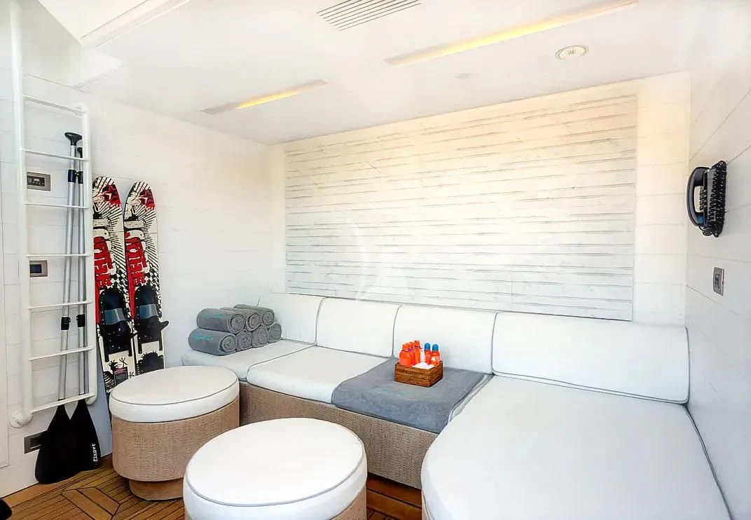 a small bathroom with a shower unit aboard NELA Yacht for Charter