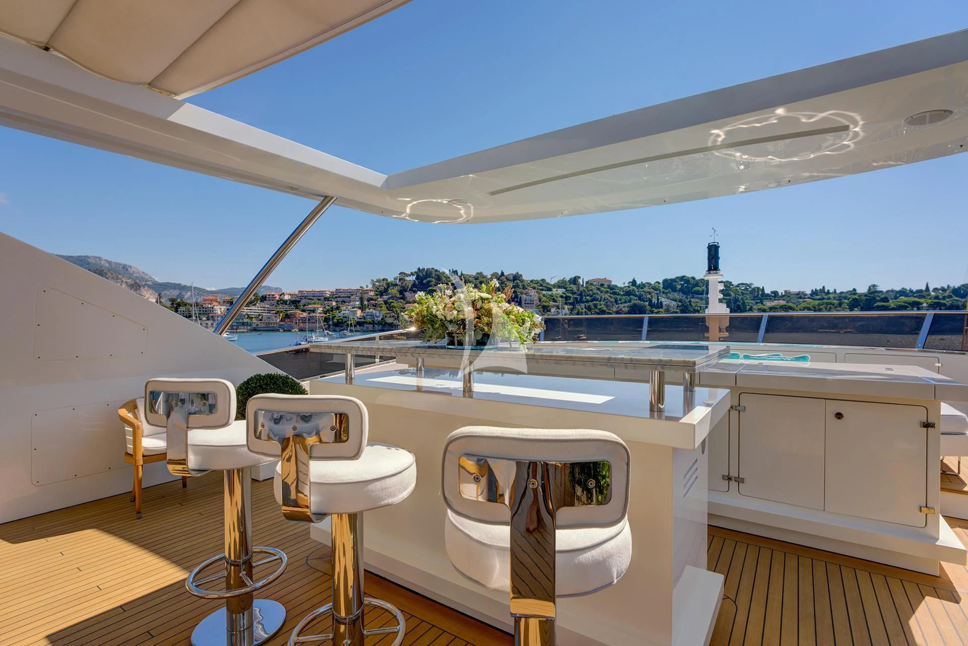 a room with a table and chairs aboard NELA Yacht for Charter