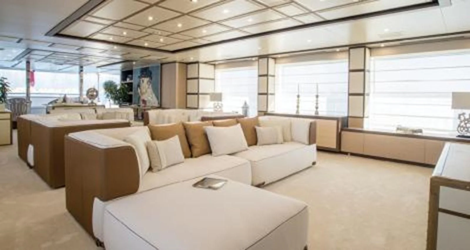 a room with a couch and a table aboard NELA Yacht for Charter