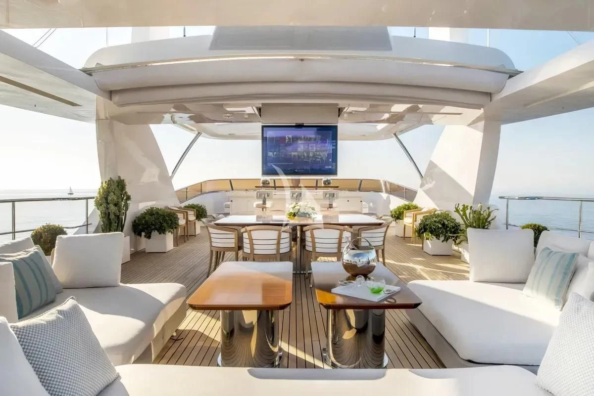 a room with a table and chairs aboard NELA Yacht for Charter