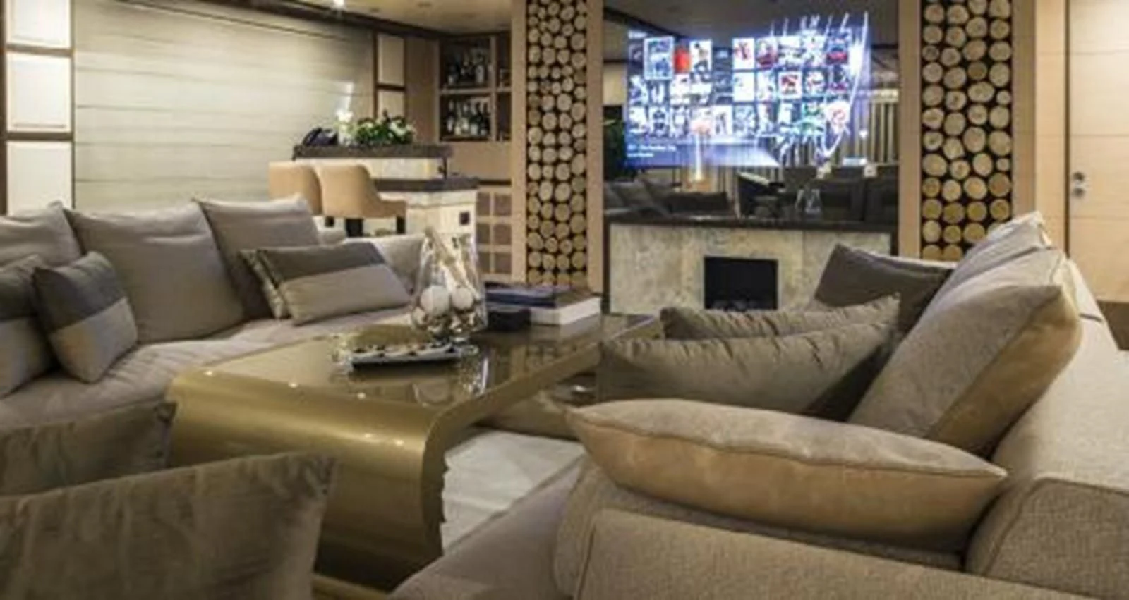 a living room with a large screen aboard NELA Yacht for Charter
