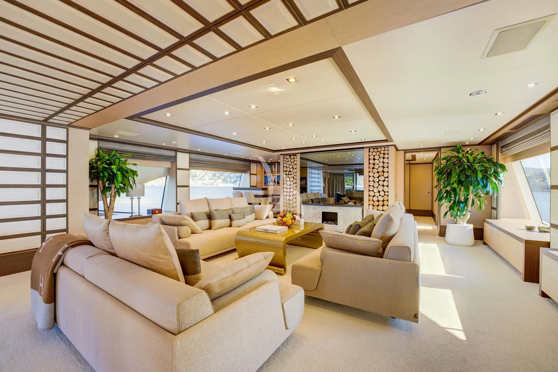 a living room with white furniture aboard NELA Yacht for Charter