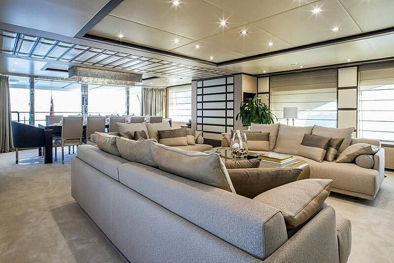 a large living room with a large window aboard NELA Yacht for Charter