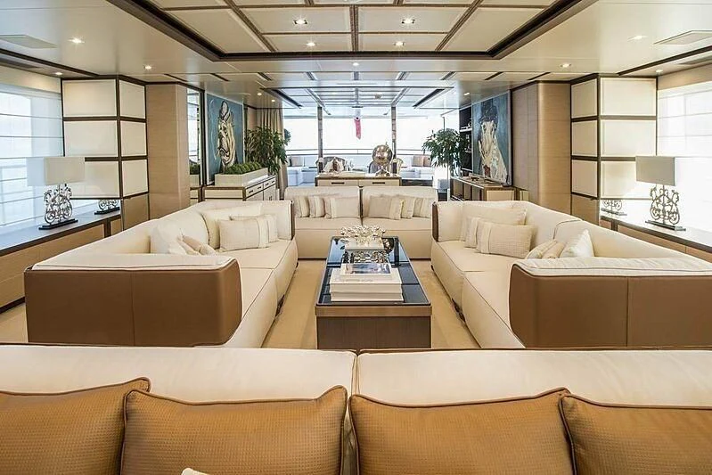a living room with couches and a table aboard NELA Yacht for Charter
