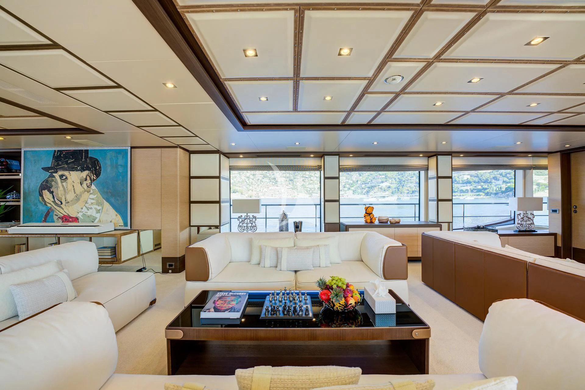 a living room with a large window aboard NELA Yacht for Charter
