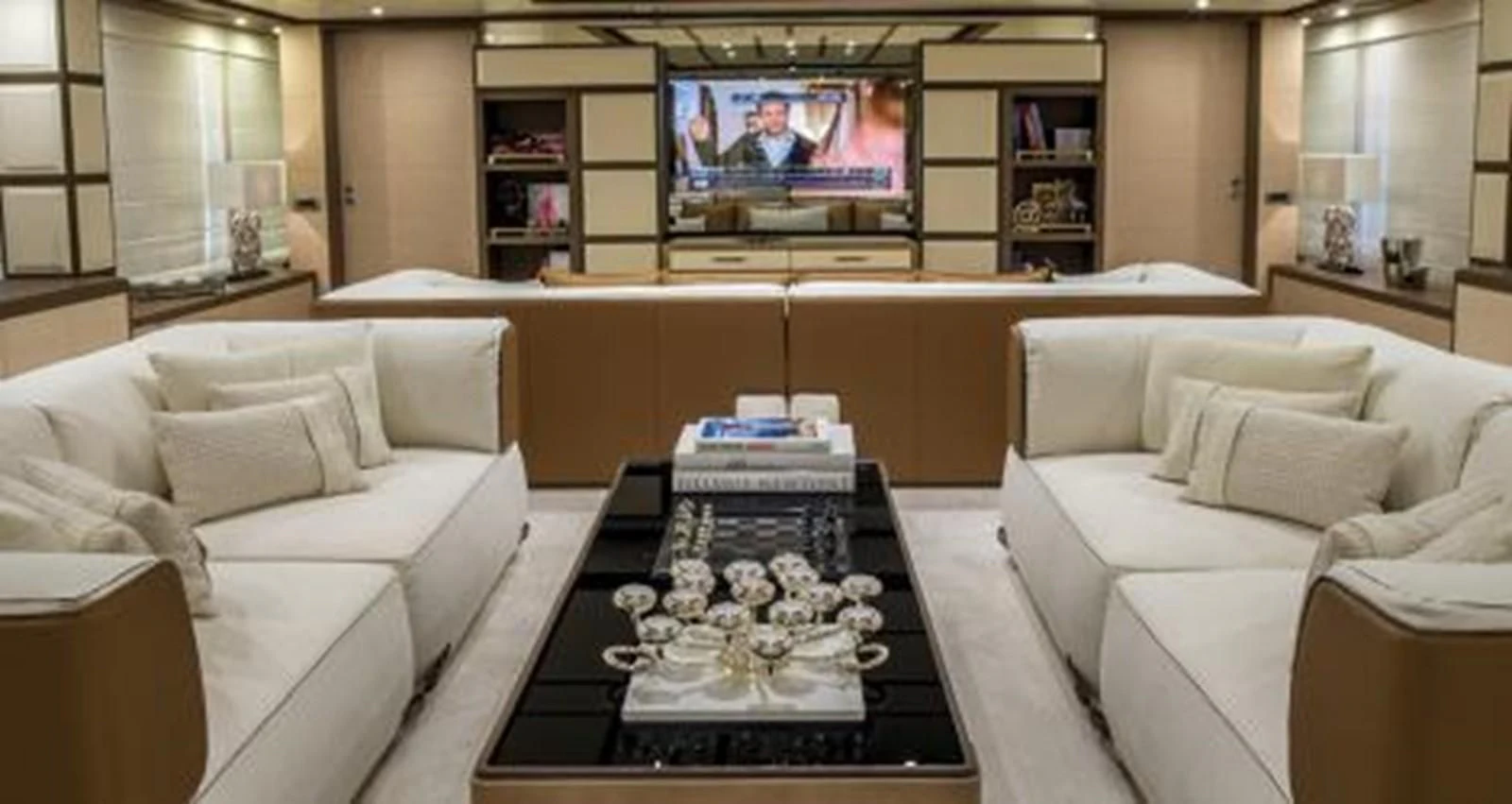 a living room with a large television aboard NELA Yacht for Charter