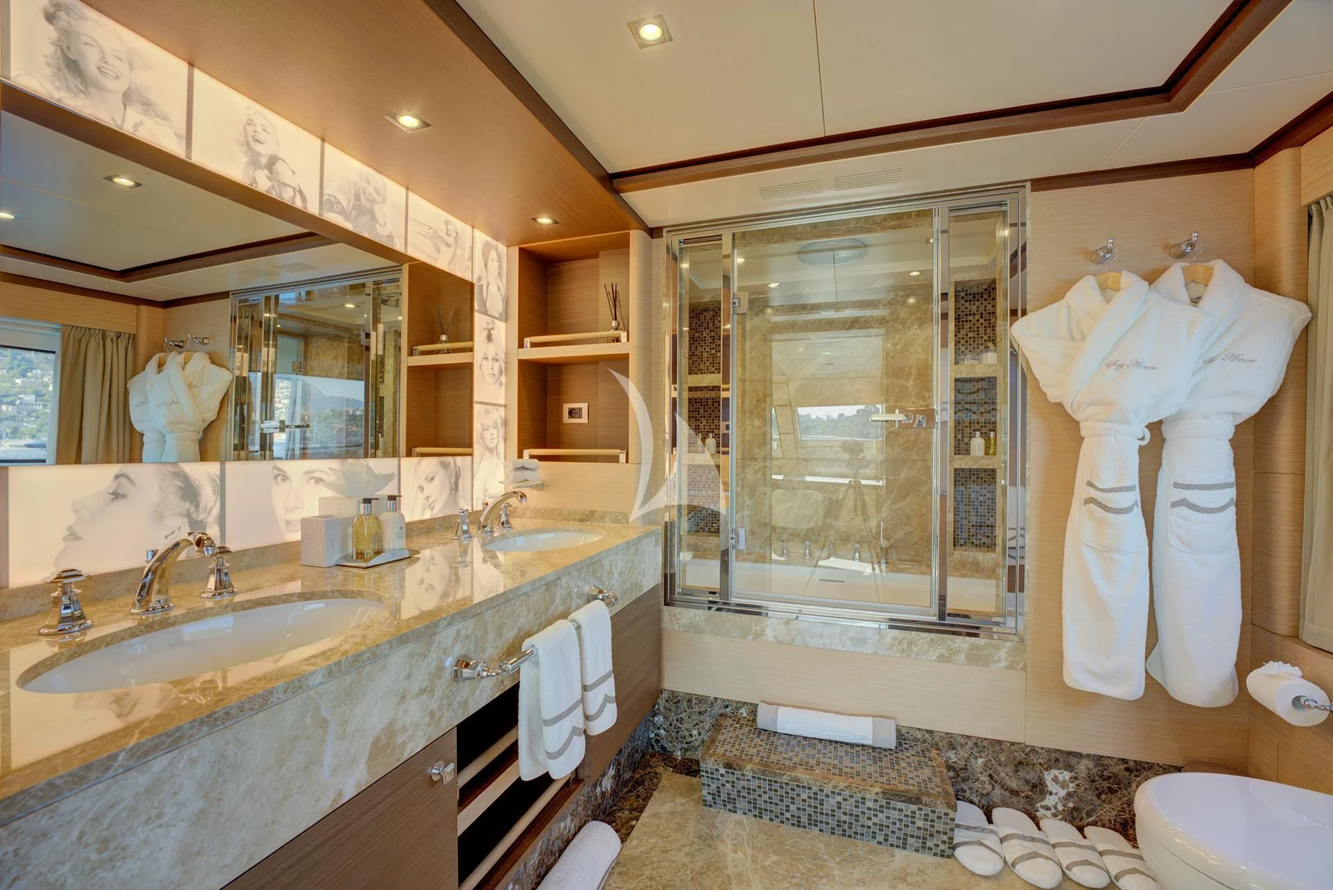 a bathroom with a large mirror aboard NELA Yacht for Charter