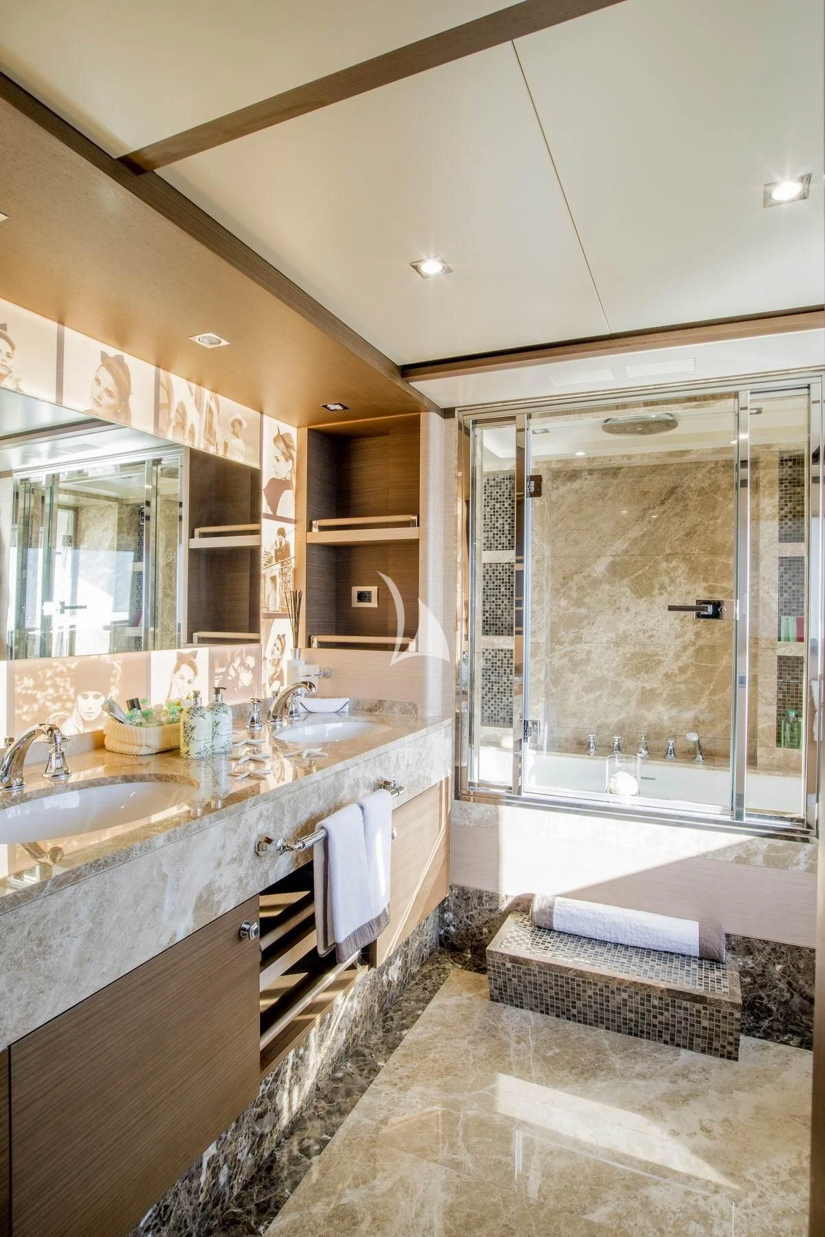 a bathroom with a large mirror aboard NELA Yacht for Charter