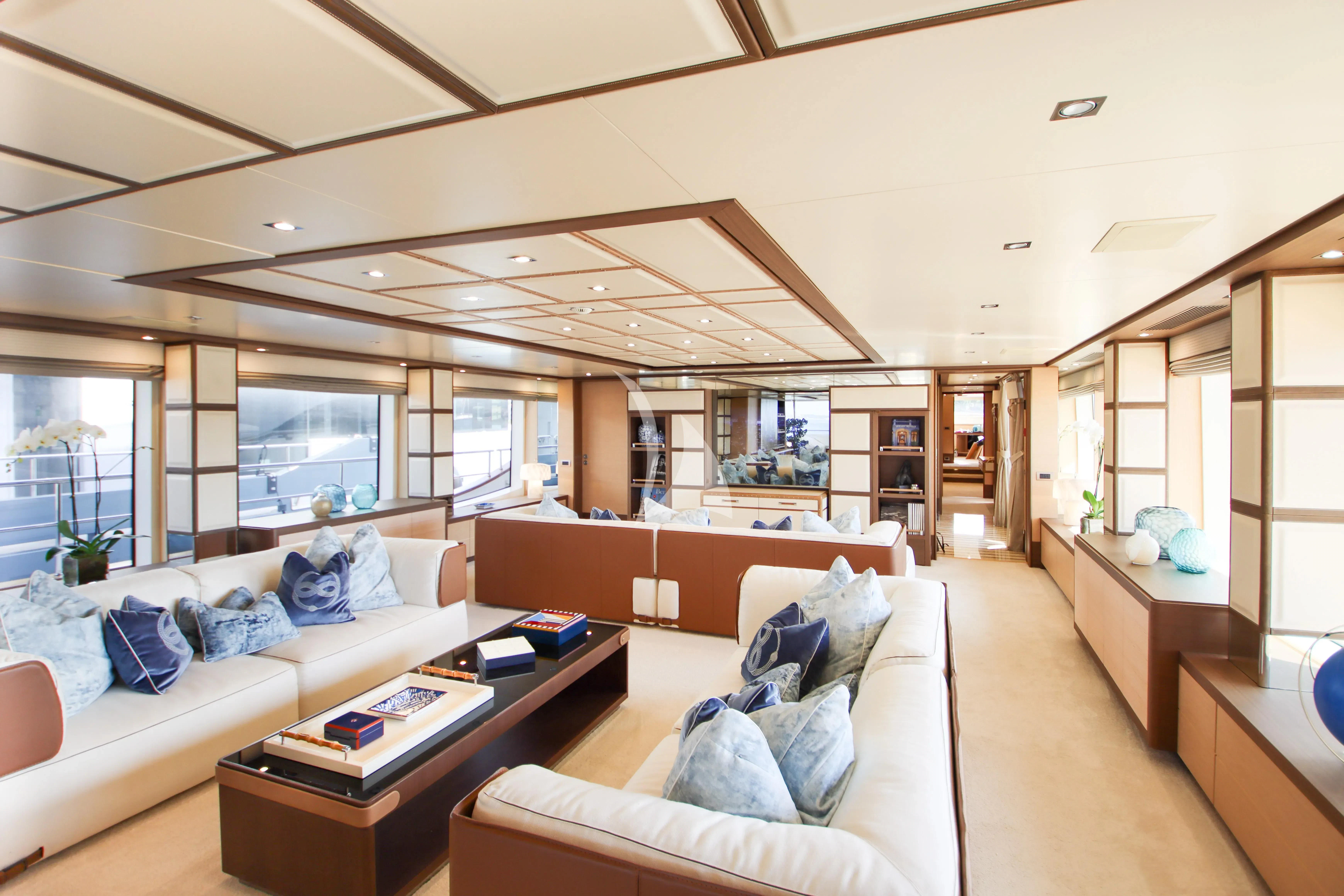 a living room with a large window aboard NELA Yacht for Charter