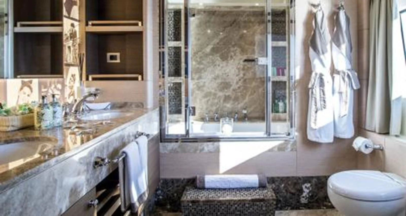 a bathroom with a large window aboard NELA Yacht for Charter