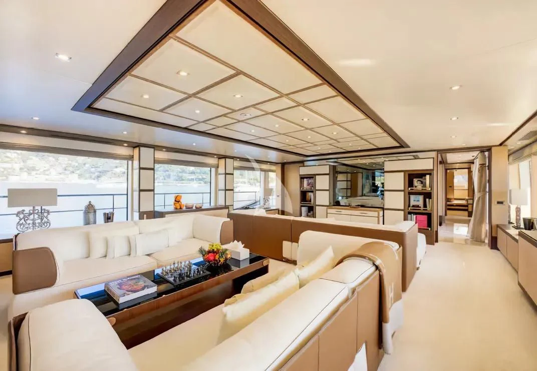 a living room with a large window aboard NELA Yacht for Charter