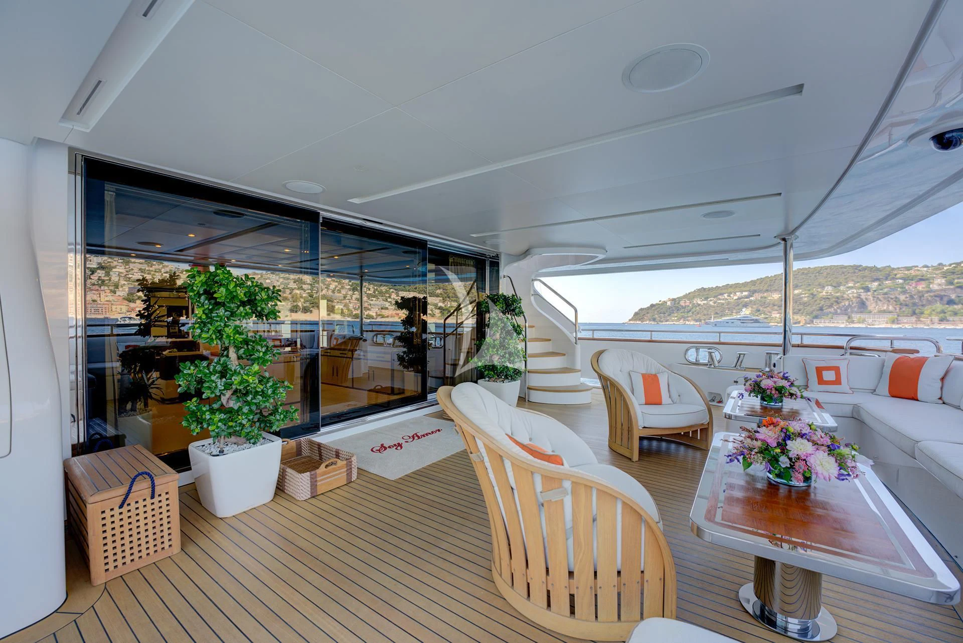 a room with a table and chairs aboard NELA Yacht for Charter