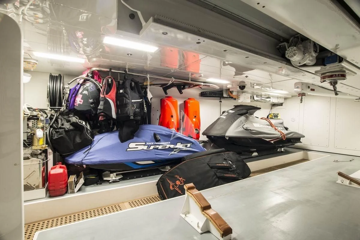 a large room with luggage and bags aboard NELA Yacht for Charter