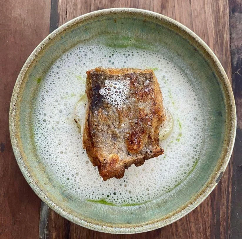 a plate of food aboard NELA Yacht for Charter