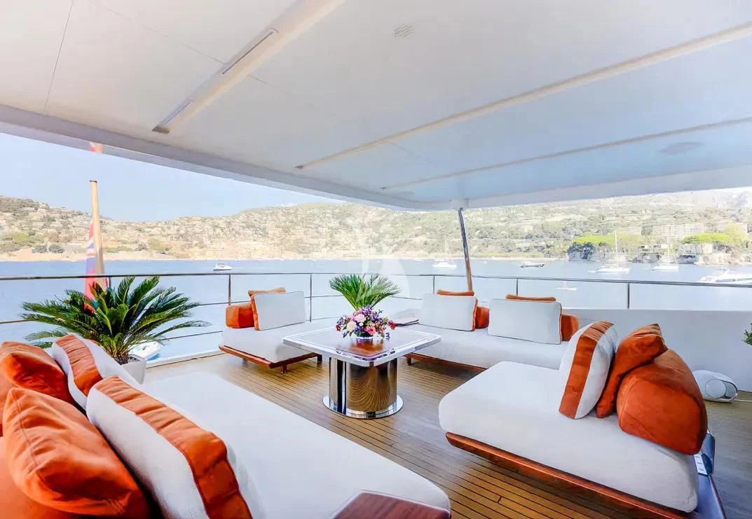 a room with a table and chairs aboard NELA Yacht for Charter