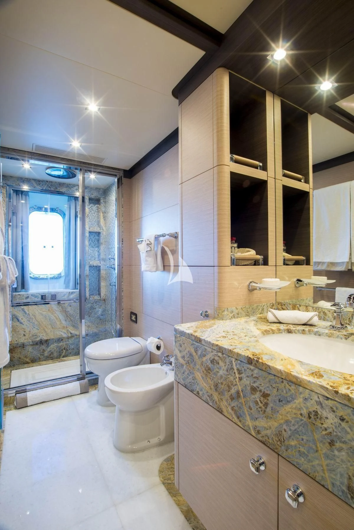 a bathroom with a glass shower aboard NELA Yacht for Charter