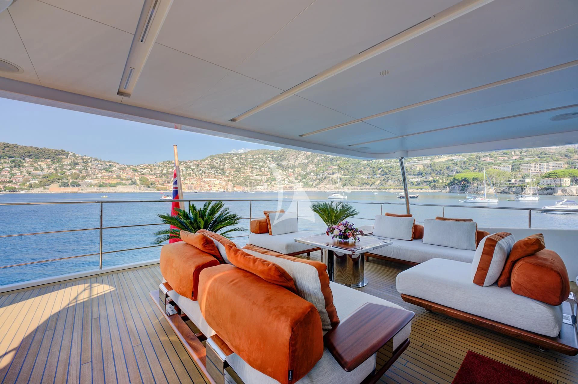 a room with couches and a table and chairs aboard NELA Yacht for Charter