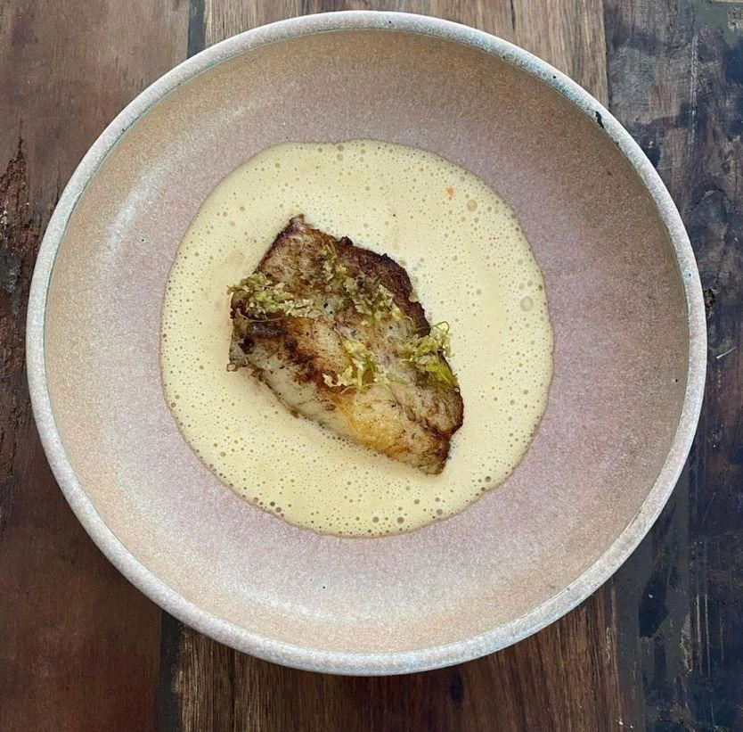 a plate of food aboard NELA Yacht for Charter