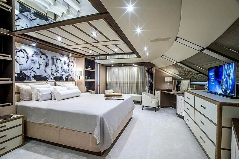 a room with a bed and a tv aboard NELA Yacht for Charter
