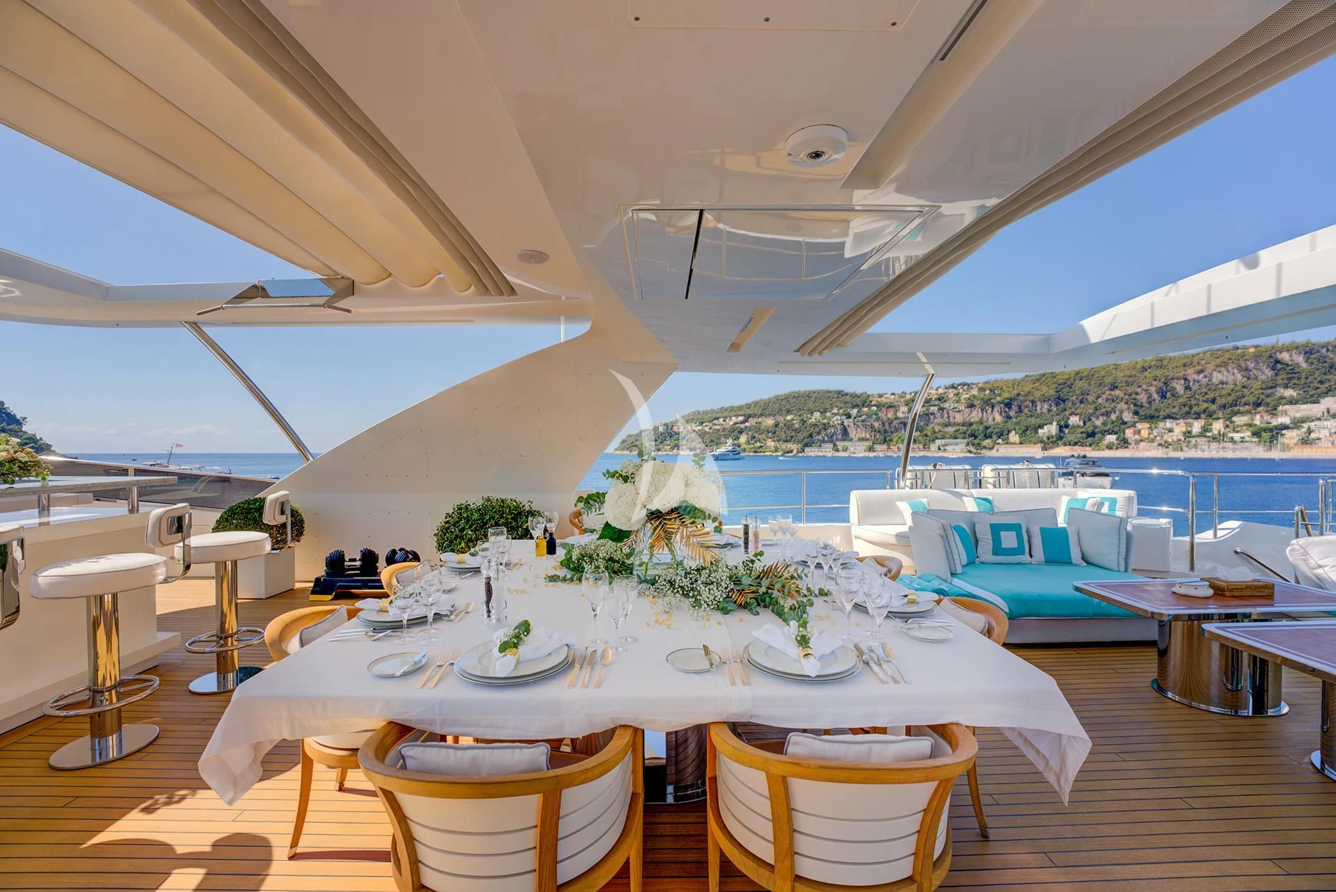 a room with a table and chairs aboard NELA Yacht for Charter
