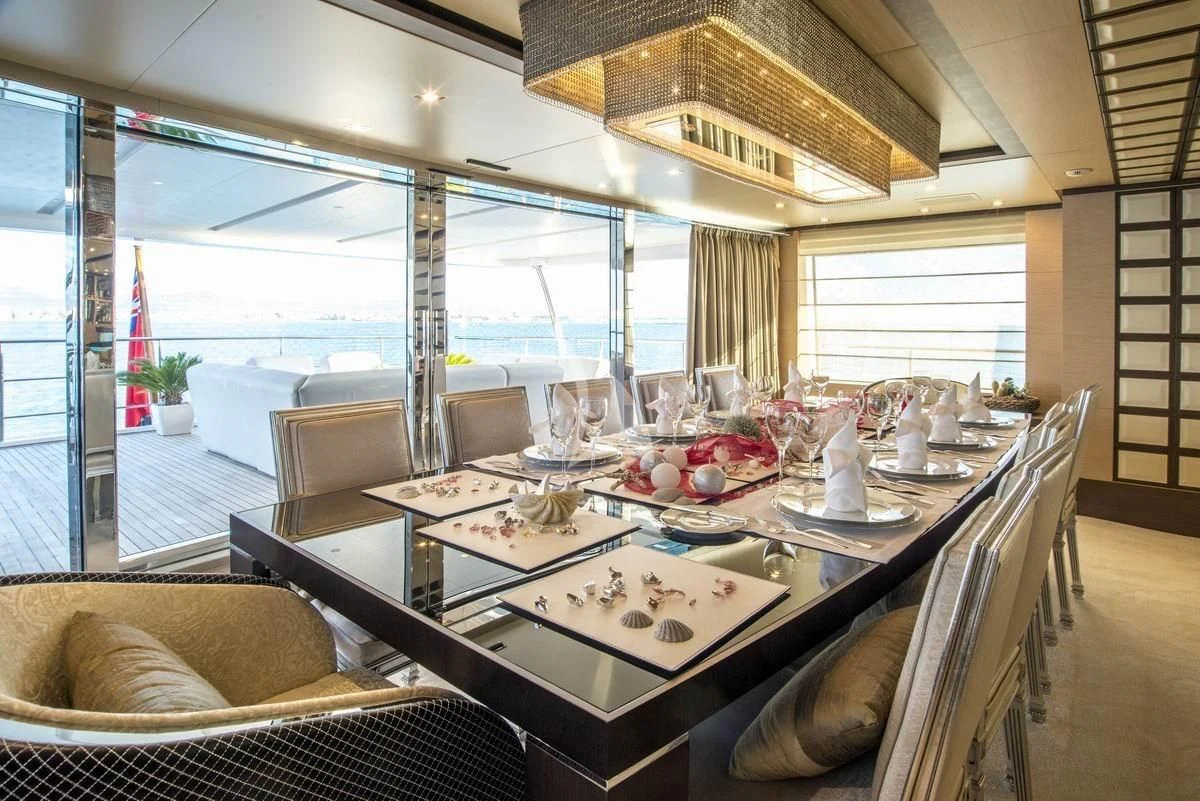 a dining table in a room aboard NELA Yacht for Charter