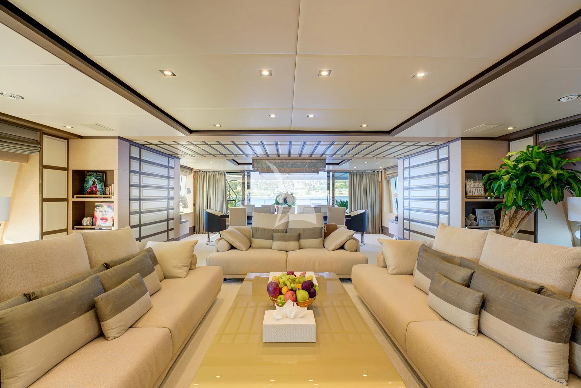 a living room with a large window aboard NELA Yacht for Charter