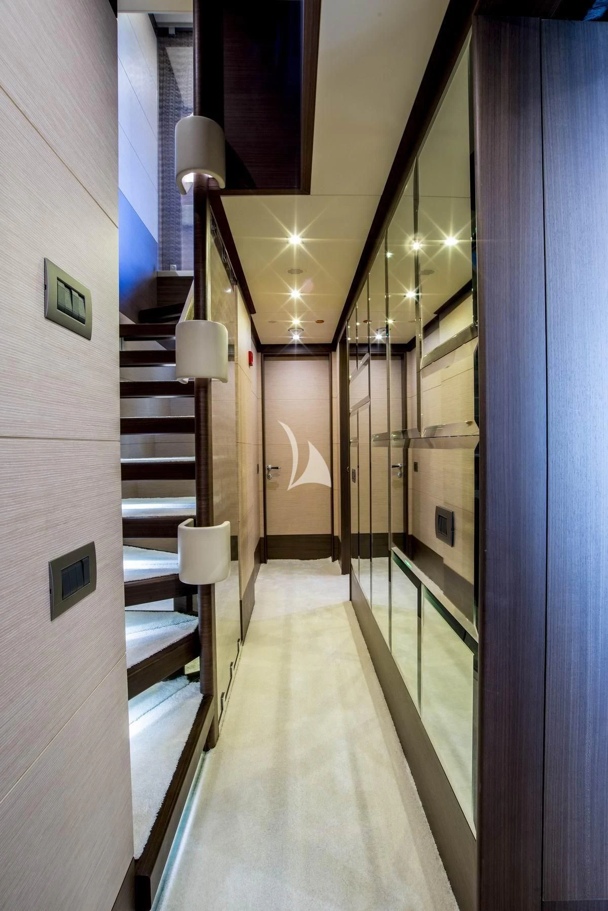 a hallway with a railing aboard NELA Yacht for Charter