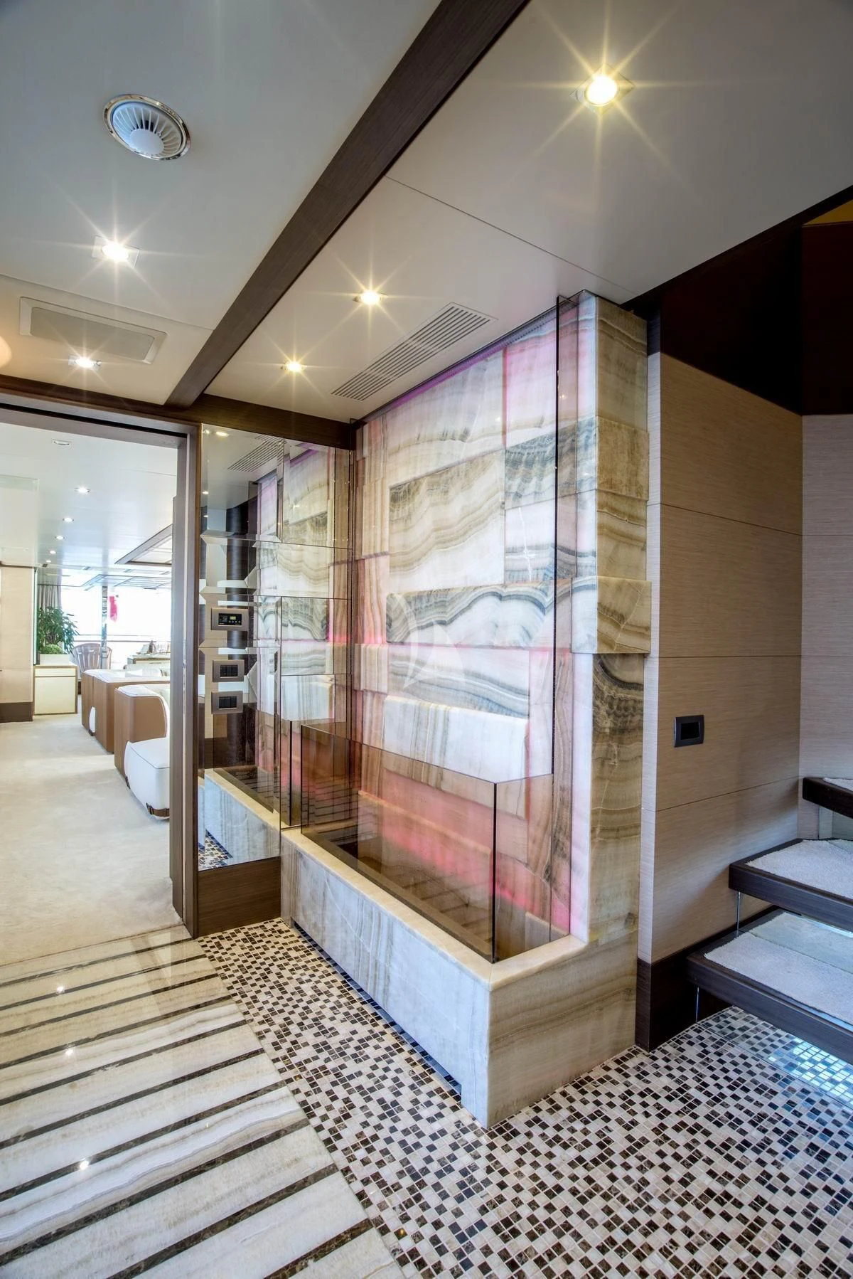 a glass shower enclosure in a bathroom aboard NELA Yacht for Charter