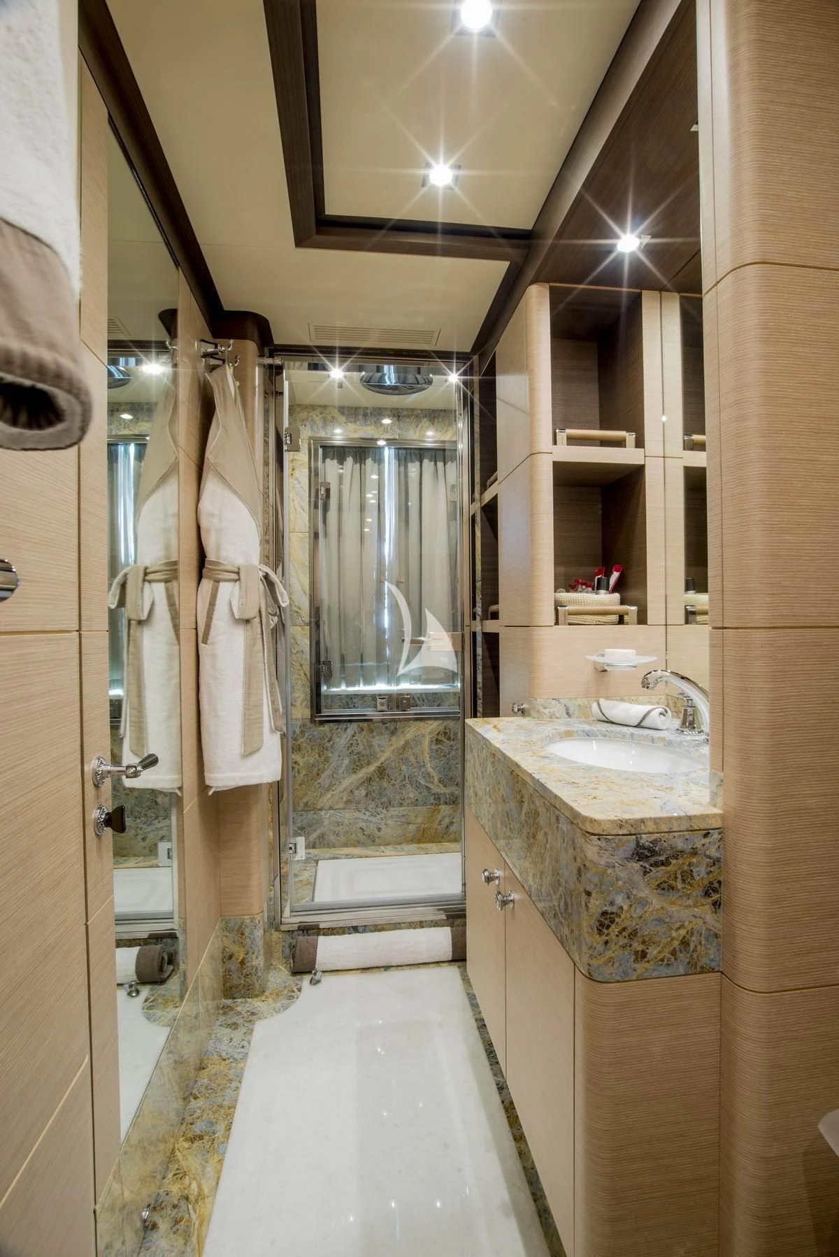 a bathroom with a glass shower aboard NELA Yacht for Charter