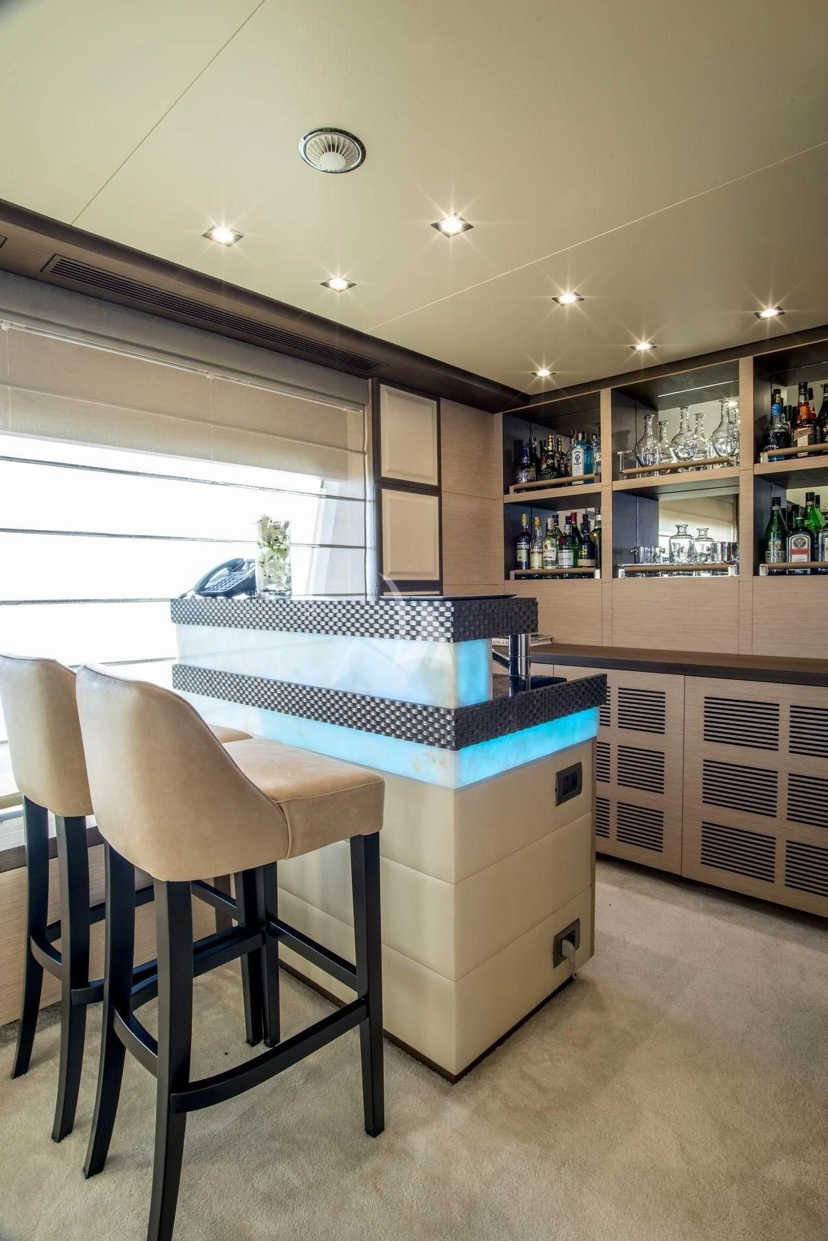 a room with a table and chairs aboard NELA Yacht for Charter