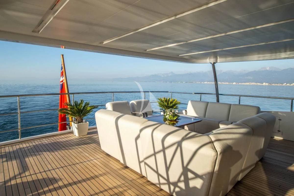 a large balcony overlooking the ocean aboard NELA Yacht for Charter