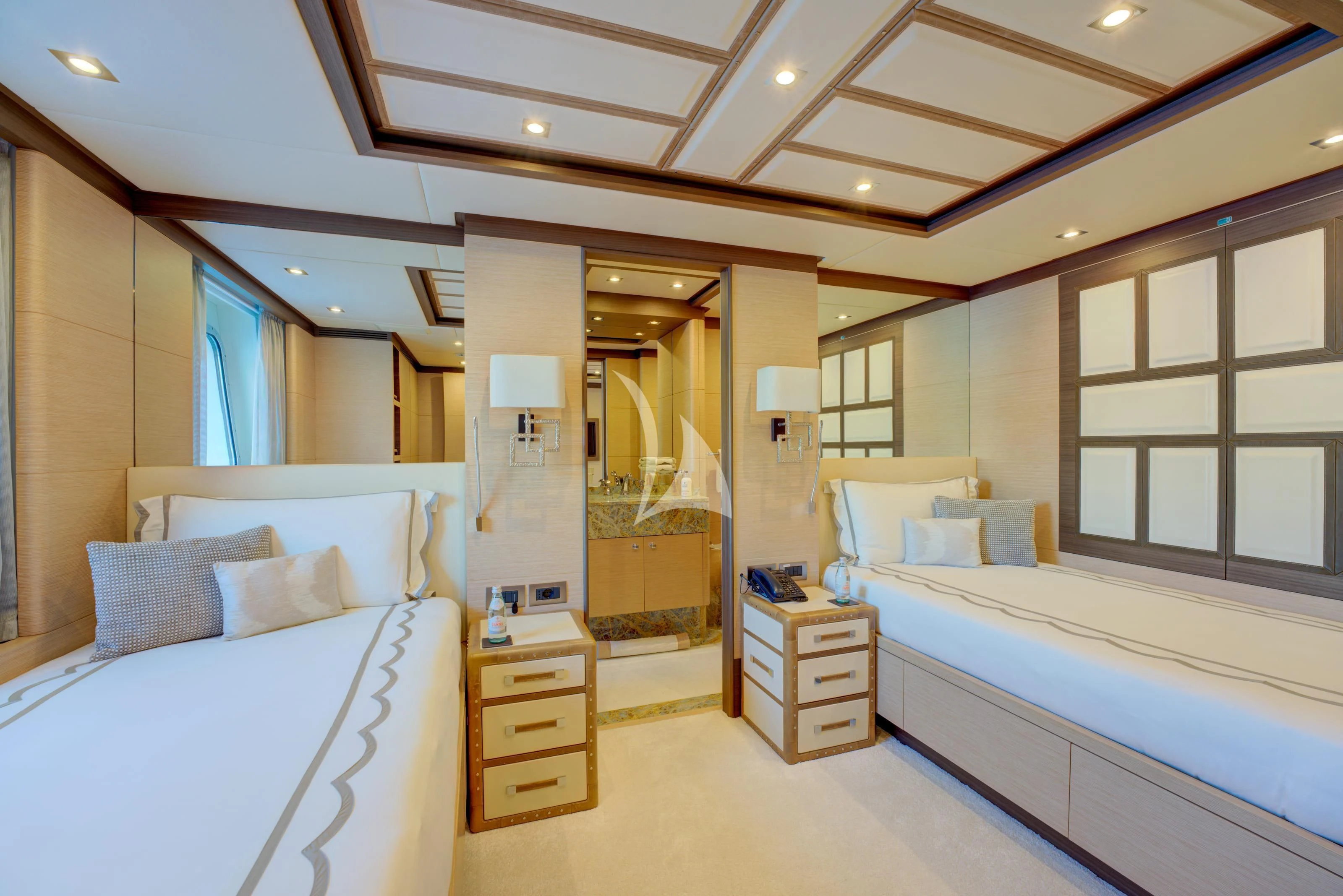 a room with a bed and a mirror aboard NELA Yacht for Charter